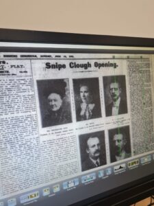 An old newspaper article onscreen.