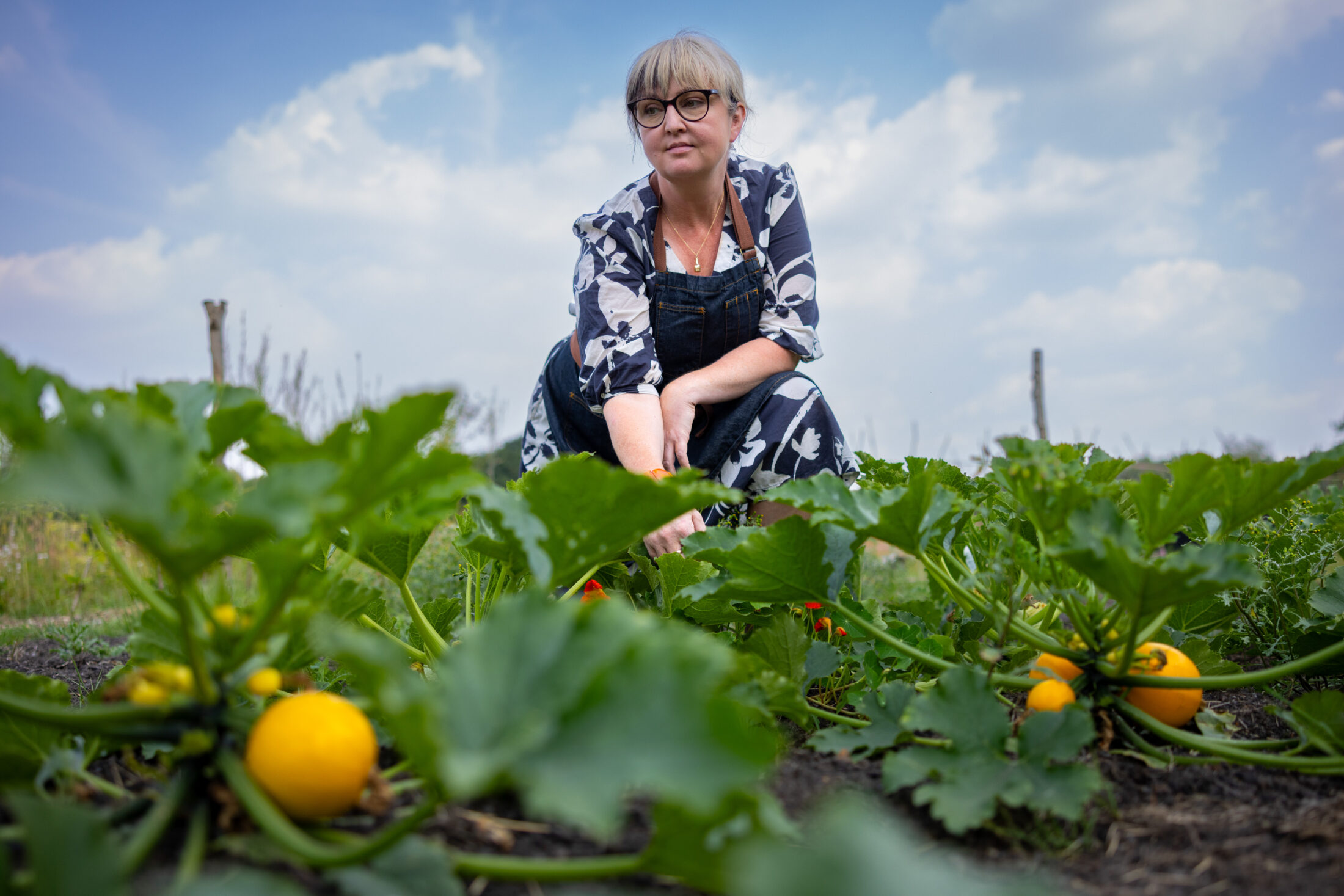 Chef Mary Ellen McTague assessing the fresh veg growing onsite.
