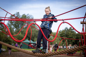 Young person on play equipment.